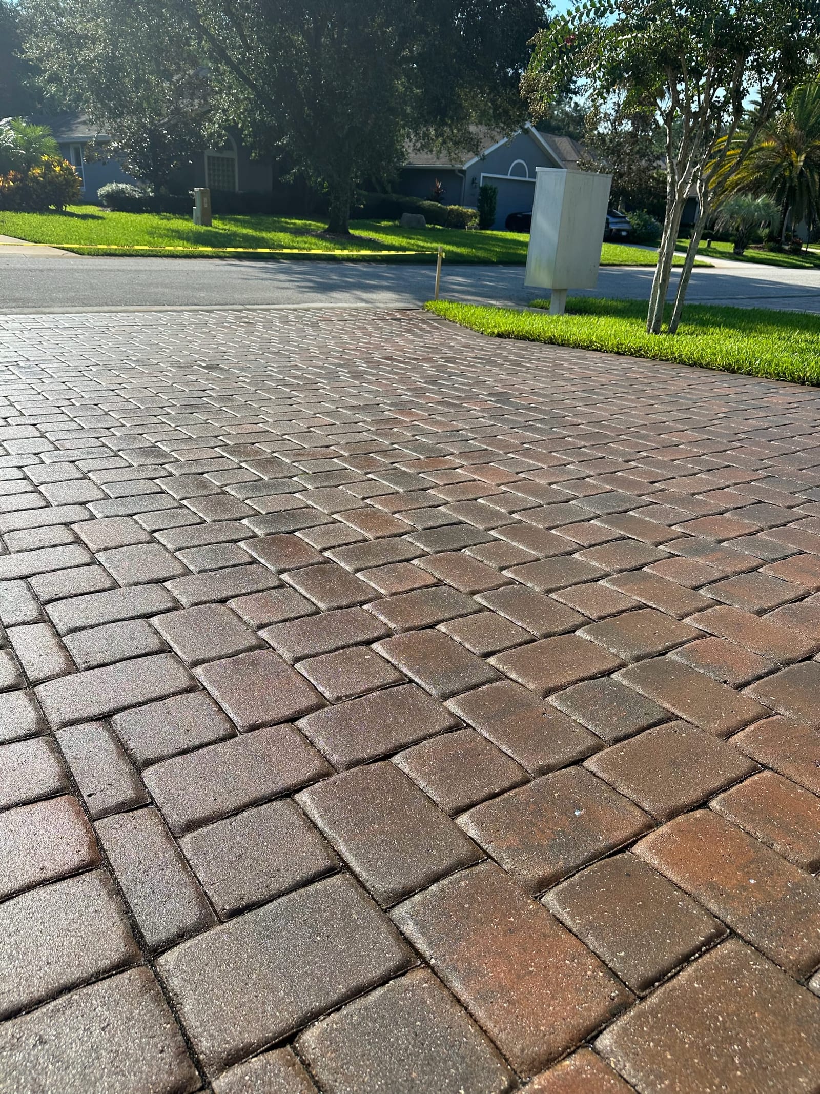 Gloss finish in full sun — paver sealing by Wintz Enterprise