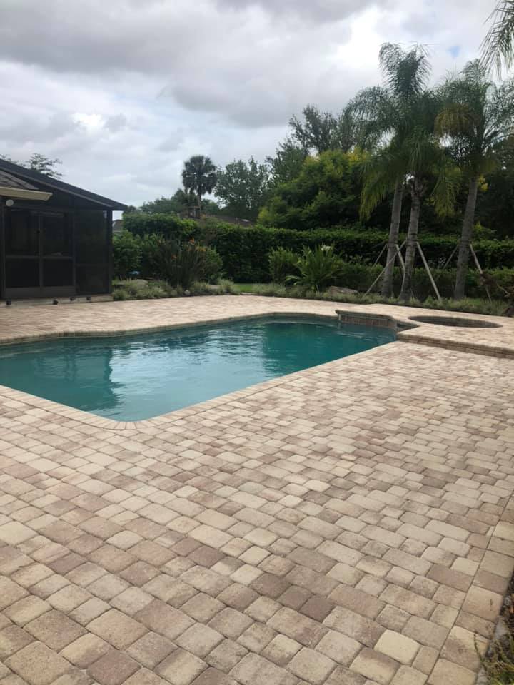 Faded pool deck pavers before sealing